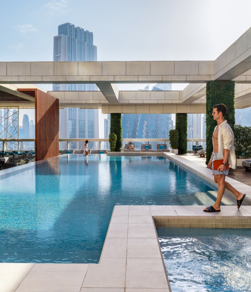 A view of the Dubai skyline from an infinity pool on the roof of a Hilton hotel